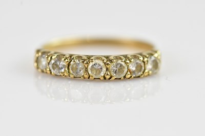 Lot 2375 - A yellow metal dress ring, set with seven...