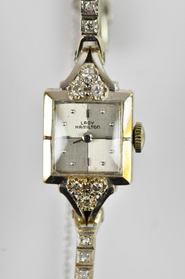 Lot 495 - LADY HAMILTON; a white metal Art Deco diamond...