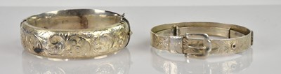 Lot 1058 - Two hallmarked silver hinged snap bangles,...