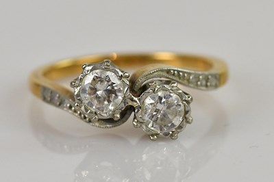 Lot 2374 - An 18ct yellow gold diamond and platinum...