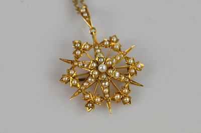 Lot 1309 - A Victorian yellow metal seed pearl set star...