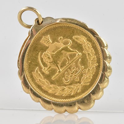 Lot 2035 - An Iranian 1/2 Pahlavi gold coin, set in a 9ct...