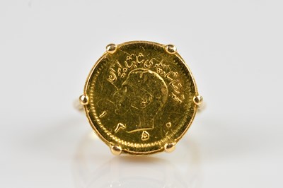 Lot 2362 - A Pahlavi 1/4 coin, set in a yellow metal ring...