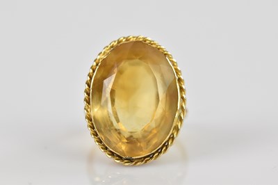 Lot 2363 - A yellow metal citrine set dress ring, the...