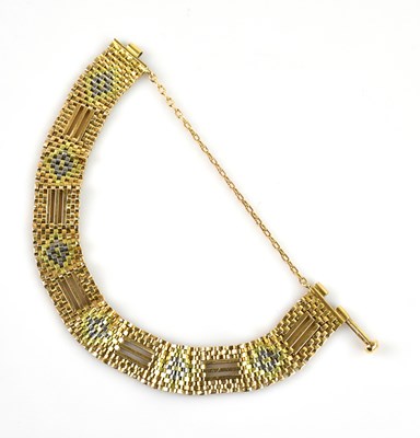 Lot 1096 - An Iranian yellow metal gate link tri-metal...
