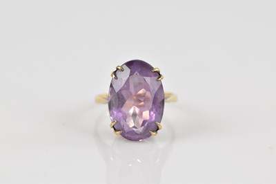 Lot 2568 - A yellow metal mounted dress ring, stamped '9c'...