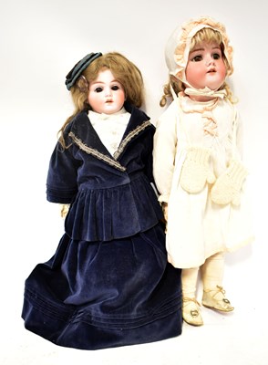 Lot 542 - An early 20th century bisque head doll, with...