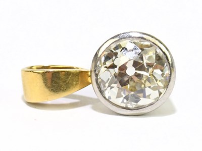 Lot 1295 - A white and yellow metal diamond pendant, the...
