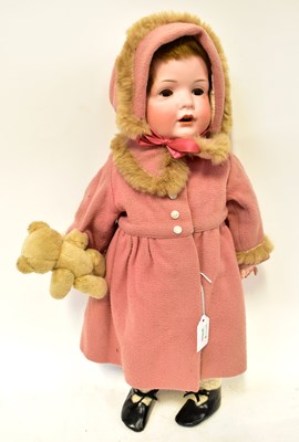 Lot 511 - A German bisque head doll, stamped 585 12...