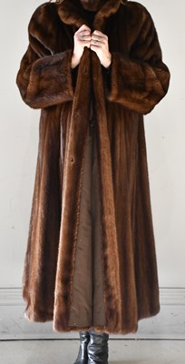Lot 208 - FURS OF MAYFAIR LTD; a full length mid brown...