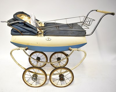 Lot 622 - A vintage dolls' coach built pram in blue and...
