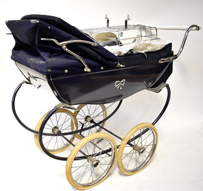 Lot 640 - A Silver Cross coach built pram in navy blue...