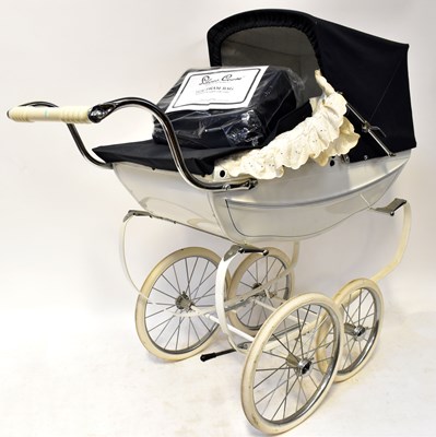 Lot 639 - A Silver Cross coach built pram in navy blue...