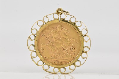 Lot 2042 - A George V full sovereign, set in a 9ct gold...