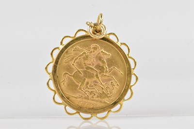 Lot 2043 - An Edward VII full sovereign, 1907, set in a...