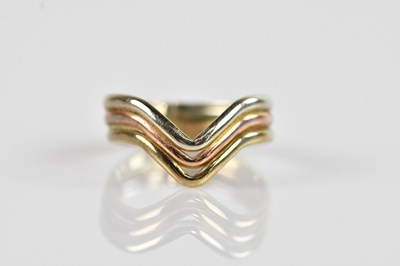 Lot 2597 - A tri-coloured metal wishbone type dress ring,...