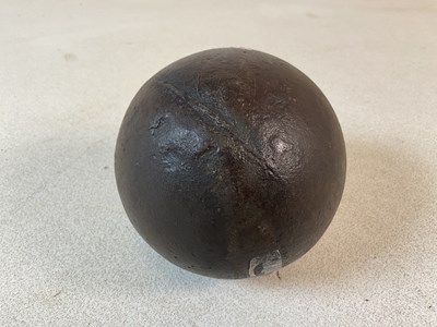 Lot 148 - A cannonball, diameter 12cm.