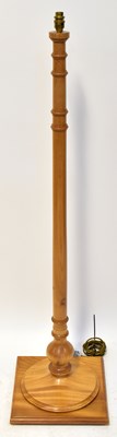 Lot 106 - A modern pine standard lamp with ring turned...