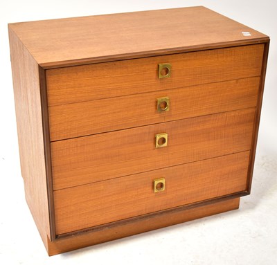 Lot 24 - A mid-20th century teak chest of four long...