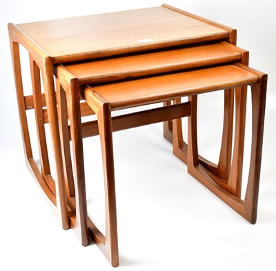Lot 1 - G-PLAN; a Quadrille teak nest of three tables,...