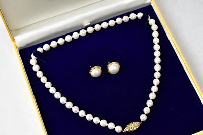 Lot 1347 - A pearl necklace with an 18ct gold diamond set...