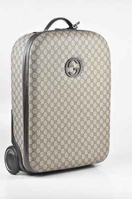 Lot 1 - GUCCI; a GG monogram carry-on suitcase...