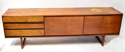 Lot 12 - A mid-20th century teak sideboard with three...