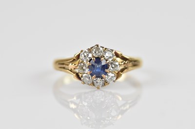 Lot 2488 - An 18ct yellow gold diamond and sapphire...