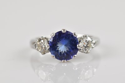 Lot 2279 - A white metal diamond and tanzanite three...