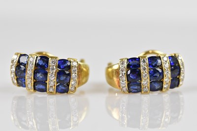 Lot 1380 - A pair of yellow metal diamond and sapphire...
