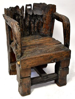 Lot 85 - A bog oak open armchair with arched back and...