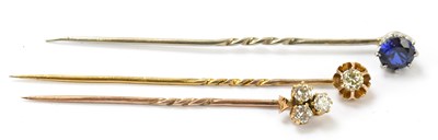 Lot 1454 - Two diamond set yellow metal tie pins, one...