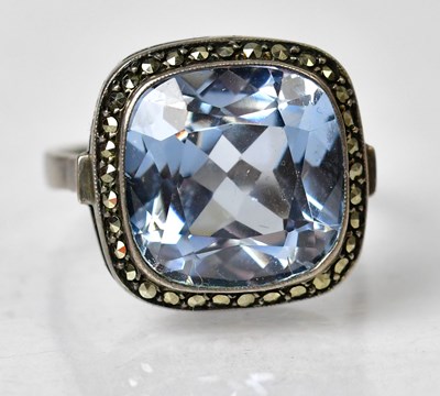 Lot 1189 - A silver dress ring set with a square cushion...