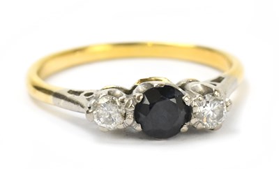 Lot 100 - A 9ct gold sapphire and diamond set three...