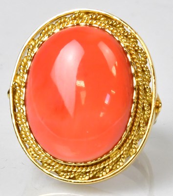 Lot 1143 - An 18ct gold cocktail ring set with an oval...