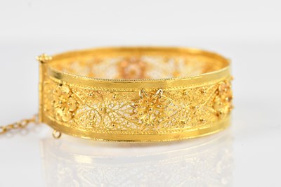 Lot 1091 - A Russian yellow gold snap bangle