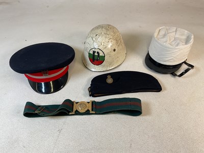 Lot 113 - A small quantity of military head wear, to...