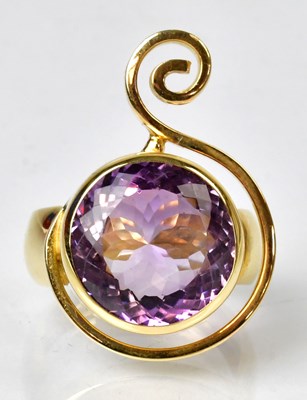 Lot 1179 - A yellow metal cocktail ring set with an oval...