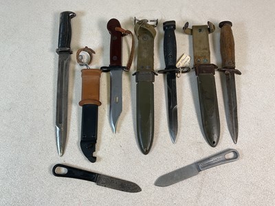 Lot 95 - Four USA bayonets and two boot knives,...