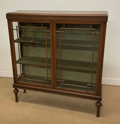 Lot 911 - A mahogany glazed cabinet, with three shelf...