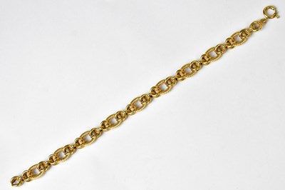 Lot 1199 - An 18ct gold textured and multi-link chain...