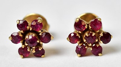 Lot 1302 - A pair of 14ct gold cluster earrings set with...