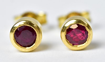 Lot 1296a - A pair of 18ct yellow gold stud earrings set...