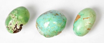 Lot 1367 - Three unmounted cabochon cut turquoise stones,...