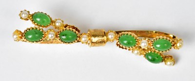 Lot 1219a - An 18ct gold brooch in the form of a bow, set...