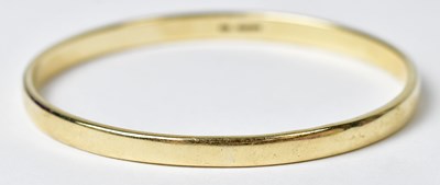 Lot 1197 - A 9ct gold bangle, stamped 375, approx. 23.3g.