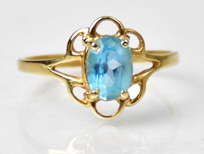 Lot 1180 - A yellow metal ring claw set with oval facet...