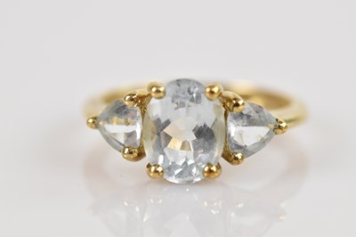 Lot 2487 - A 9ct gold aquamarine three stone dress ring,...