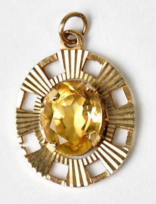 Lot 1248 - A 9ct gold pendant centrally claw set with a...