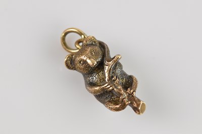 Lot 1447 - A yellow metal charm formed as a koala bear,...